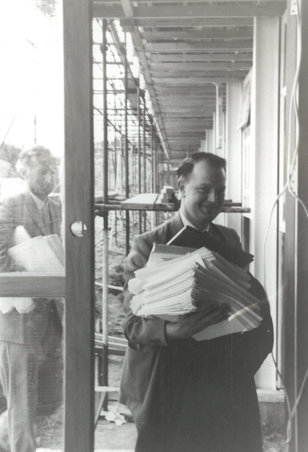 Peter Freyberg with textbooks and course material, circa March 1960