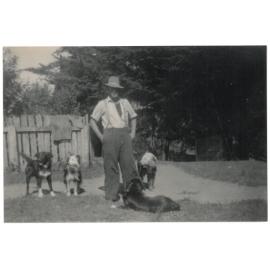Herbert "Bert" Mosen at Papahaua Station, with his "Muff" dogs and a huntaway, 1950s