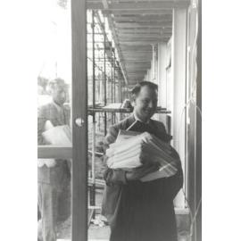 Peter Freyberg with textbooks and course material, circa March 1960